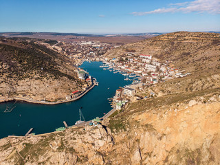 Aerial view of Balaklava landscape, small harbor with town between hills