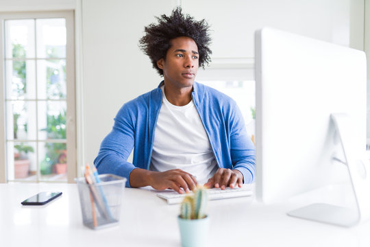 African American Man Working Using Computer With A Confident Expression On Smart Face Thinking Serious