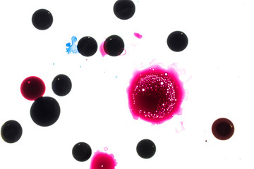Background of red, pink, black ink waves