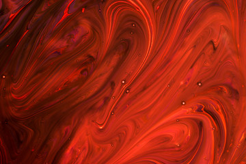 Background of red, orange, black ink waves
