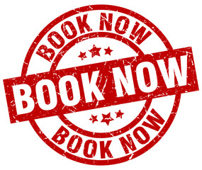 book now round red grunge stamp