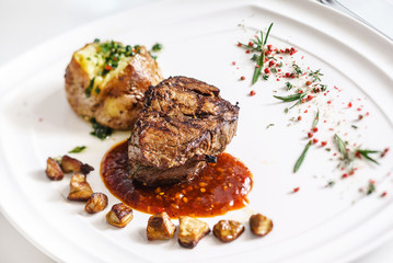 steak with baked potatoes