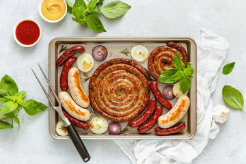 Oven roasted sausages in a sheet pan, view from above