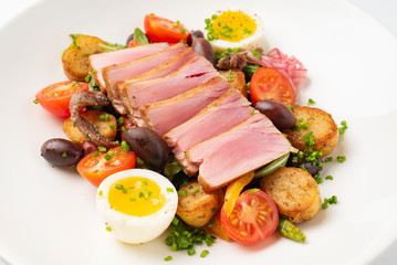 Salade niçoise on the white plate