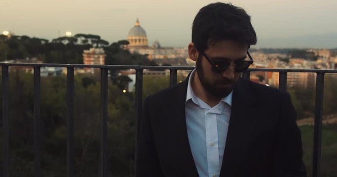 Walking down a street in Rome to take pictues and selfies of St. Peter's Basilica. The Basilica is one of the largest basilicas in the world and is located in Vatican City in Rome.