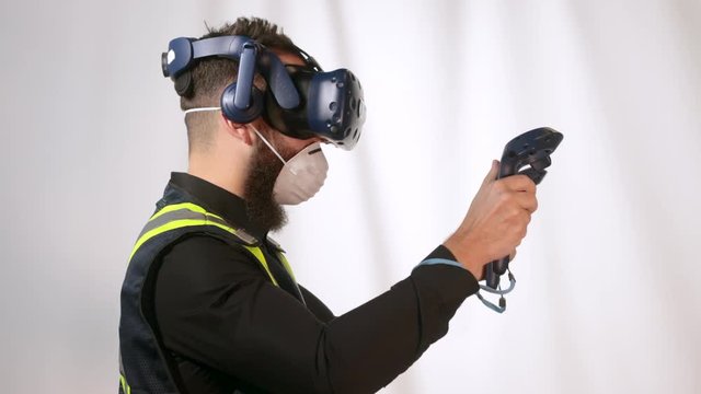 Worker wearing reflective vest have experience with VR headset
