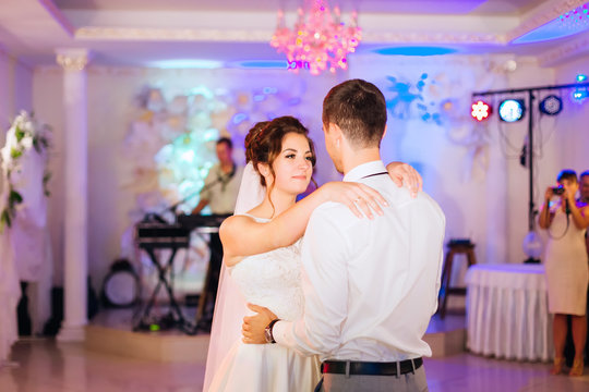 newlyweds embracing each other and dancing wedding dance. musici