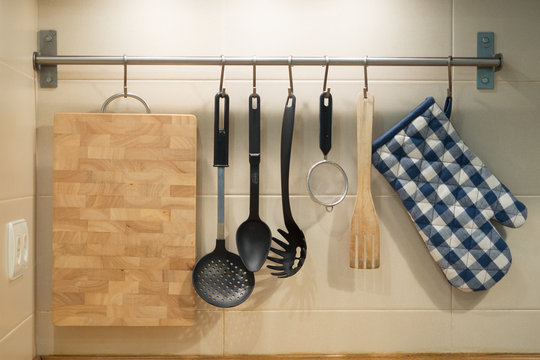 kitchen utensils hanging on the wall