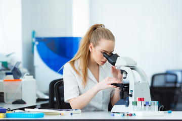 Scientist researcher using microscope in laboratory. Medical healthcare technology and...
