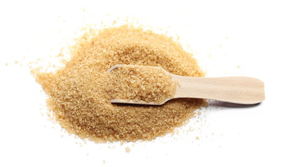 Brown cane sugar pile with wooden spoon isolated on white background and texture