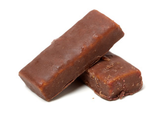 Chocolate peanut candy on white background