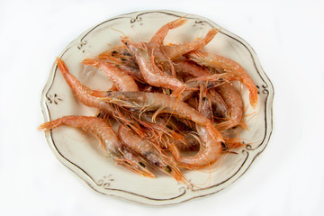 Several raw prawns served on a plate