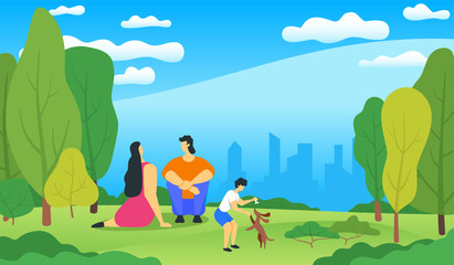 Happy family relaxing in a beautiful city park, city skyline on the background. boy playing with a dog