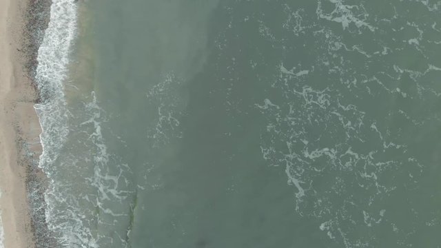 Aerial shot of sandy beach and cliff in Ustka (pomorskie, Poland) in winter.