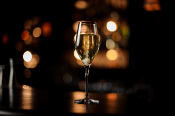 Close-up of glass with a sparkling wine on bar counter