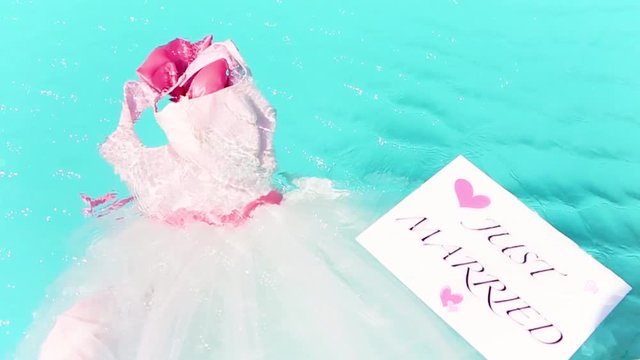 Bride's wedding dress is in the pool, Just Married