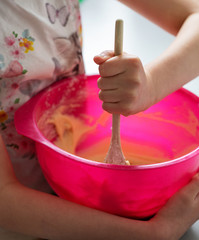 Mixing bowl child with spoon cake making