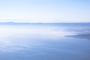Dalmatia, Croatia, in blue sea and misty fog