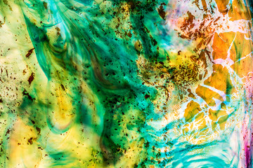 Background of blue, green, yellow, red ink waves