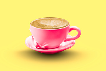 Hot coffee Espresso  topped with a heart-shaped milk on a yellow background with clipping path.