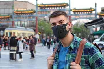 Man wearing protective mask in trip to Asia 