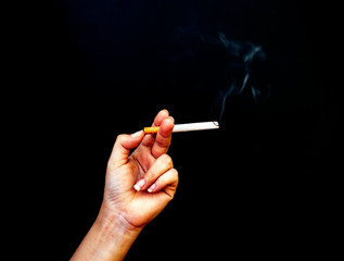 Image of cigarette in hand with smoke
