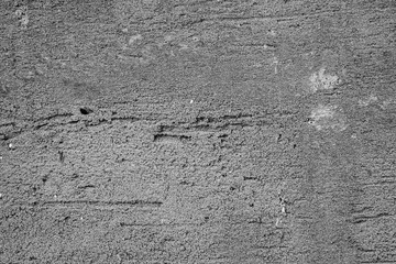 The concrete texture, wall, with cracks and scratches can be used as a  background, web banner with space for text