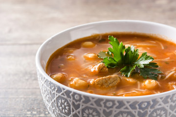 Harira soup in bowl on wooden table. Typical Moroccan food. Ramadán concept.