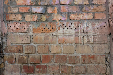 The brick texture, wall, with cracks and scratches can be used as a  background