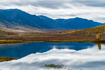 Panorama of wild forest lake in autumn season, Russia