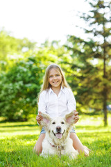 Teen  girl with golden retriever dog in the park