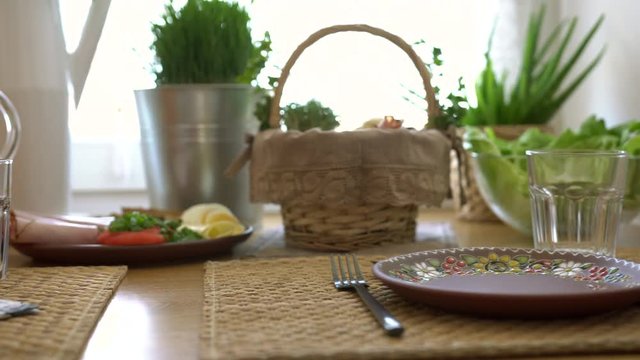 Slider shot of delicious easter breakfast on the table. Breakfast or brunch table filled with all sorts of food ready for an Easter meal.