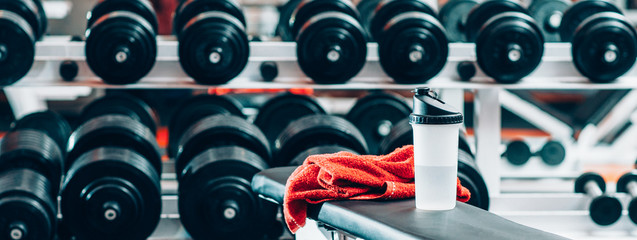 Sport and recreation. Fitness and bodybuilding concept. Weight training. Closeup of towel and...