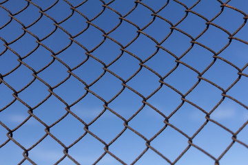 Naklejka premium Protective mesh on a blue background