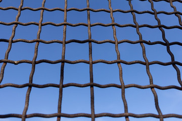 Fototapeta premium Protective mesh on a blue background