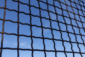 Fototapeta premium Protective mesh on a blue background