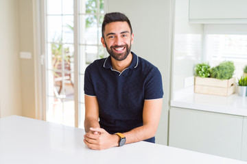 Fototapeta premium Handsome hispanic man at home with a happy and cool smile on face. Lucky person.