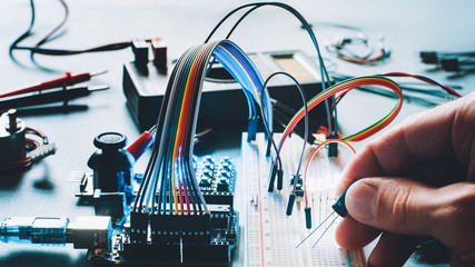 Microcontroller innovation. Hardware engineering hobby. Electronic breadboard components....