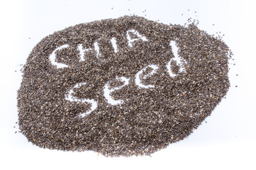 Chia seeds in wood bowl, isolated on white background.