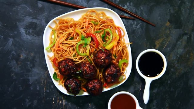 Manchurian Hakka / Schezwan noodles footage or clip, popular indochinese food served in a bowl. selective focus