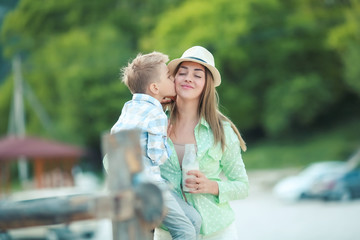 Fototapeta premium Mother and son holding hand in hand