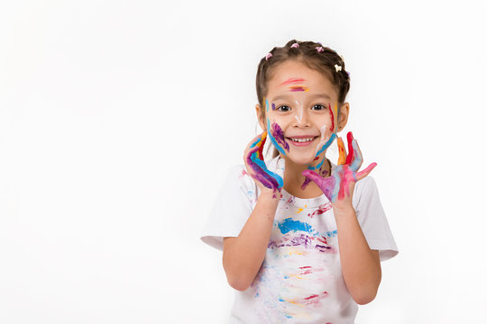 happy cute little child girl with hands painted in colorful paint isolated on white background.