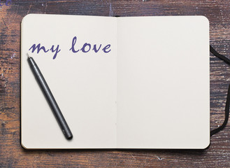notebook and pen on white background