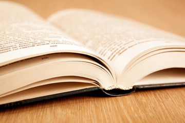 new open book on a wooden table