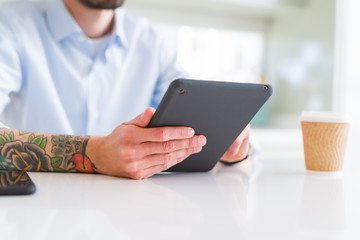 Close up of business man working using touchpad tablet