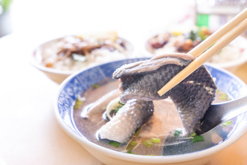 Milkfish skin soup, distinctive Taiwan delicacy food in Tainan. Famous meal set for lunch or breakfast with vegetable, top view, copy space, close up