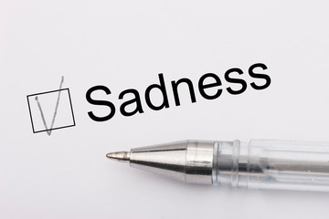 Obraz premium Sadness - checkbox with a cross on white paper with pen. Checklist concept.