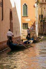 Fototapeta na wymiar Venice, Italy - August/ 27/ 2018 - Gondolas on canal in venice