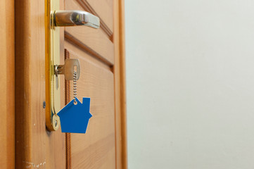 A key in a lock with house icon on it