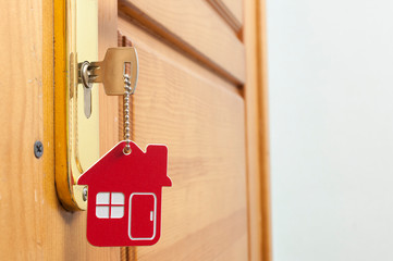 A key in a lock with house icon on it
